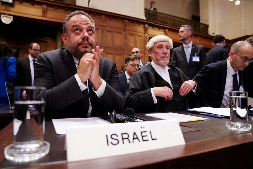 Legal adviser to Israel's Foreign Ministry Tal Becker and British jurist Malcolm Shaw sit inside the International Court of Justice (ICJ) as judges hear a request for emergency measures to order Israel to stop its military actions in Gaza, in The Hague, Netherlands January 12, 2024. REUTERS/Thilo Schmuelgen