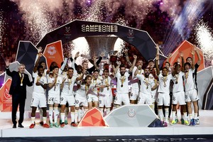 Soccer Football - Spanish Super Cup - Final - Real Madrid v FC Barcelona - Al-Awwal Stadium, Riyadh, Saudi Arabia - January 15, 2024  
Real Madrid's Nacho lifts the trophy with teammates and coach Carlo Ancelotti after winning the Spanish Super Cup REUTERS/Juan Medina     TPX IMAGES OF THE DAY