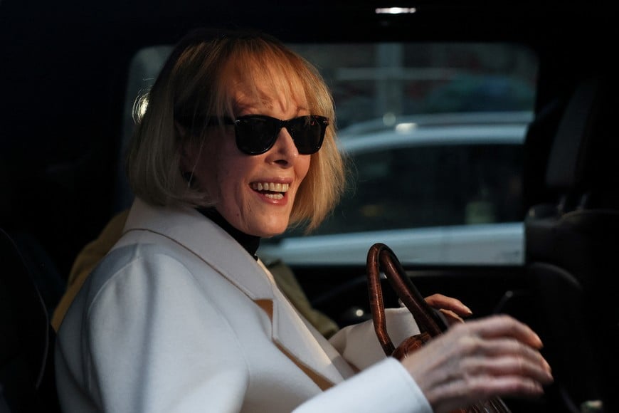 E. Jean Carroll reacts in a car outside the Manhattan Federal Court, after the verdict in the second civil trial was reached after she accused former U.S. President Donald Trump of raping her decades ago, in New York City, U.S., January 26, 2024. REUTERS/Brendan Mcdermid