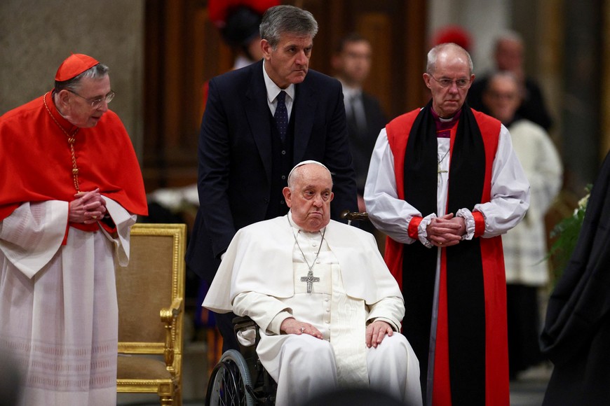 Pope Francis looks on next to Archbishop of Canterbury Justin Welby, on the day he attends the Vespers prayer service to celebrate the conversion of Saint Paul, at St Paul's Basilica in Rome, Italy, January 25, 2024. REUTERS/Guglielmo Mangiapane