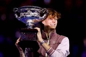 Tennis - Australian Open - Melbourne Park, Melbourne, Australia - January 28, 2024
Italy's Jannik Sinner celebrates with the trophy after winning the final against Russia's Daniil Medvedev REUTERS/Issei Kato     TPX IMAGES OF THE DAY