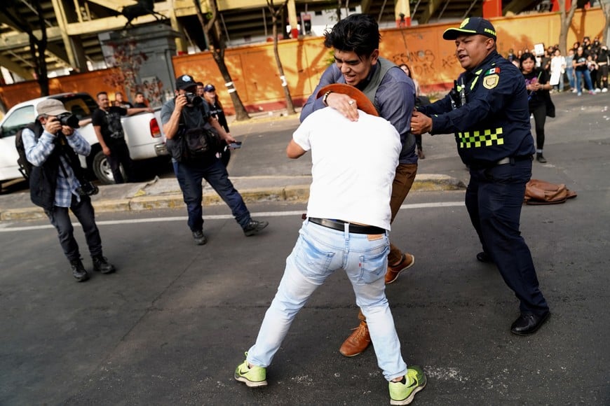 Protesters clash with attendees during a protest against the return of bullfighting, outside the Plaza de Toros Mexico bullfighting ring, in Mexico City, Mexico, January 28, 2024. REUTERS/Toya Sarno Jordan