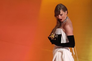 Taylor Swift departs the stage after accepting the award for Best Pop Vocal Album for Midnights during the 66th Annual Grammy Awards in Los Angeles, California, U.S., February 4, 2024. REUTERS/Mike Blake