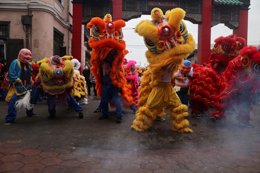 People wearing dragon costumes perform in Chinatown for the celebration of the Chinese New Year, in Lima, Peru, February 9, 2024. REUTERS/Sebastian Castaneda
?