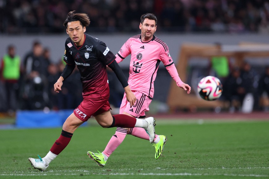 Feb 7, 2024; Tokyo, Japan; Inter Miami CF forward Lionel Messi (10) and Vissel Kobe defender Yuki Honda (15) chase down the ball during the second half of a preseason friendly at Japan National Stadium. Mandatory Credit: Naoki Nishimura-USA TODAY Sports