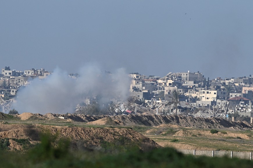 Smoke rises in central Gaza, amid the ongoing conflict between Israel and the Palestinian Islamist group Hamas, near the Israel-Gaza border, as seen from Israel, February 14, 2024. REUTERS/Dylan Martinez