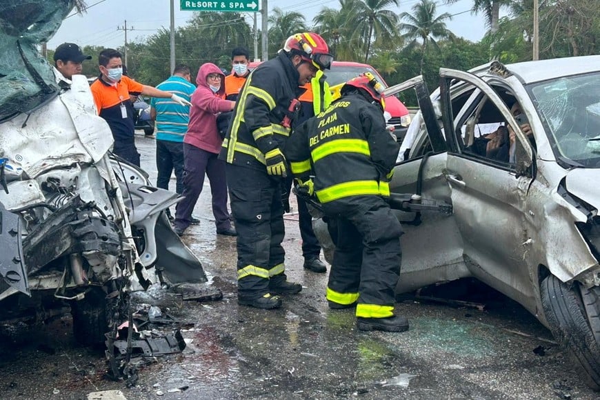 Playa del Carmen firefighters work to rescue people injured where a truck and a van crash on the Playa del Carmen-Tulum highway with some fatalities and injured people, in Playa del Carmen in the State of Quintana Roo, Mexico, in this photo released on February 18, 2024. Civil Protection of Playa del Carmen/Handout via REUTERS  THIS IMAGE HAS BEEN SUPPLIED BY A THIRD PARTY. NO RESALES. NO ARCHIVES