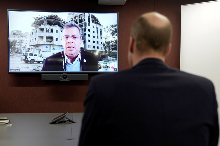 Britain's William, Prince of Wales, listens to Pascal Hundt, Senior Crisis Manager of the International Committee of the Red Cross, video calling from Gaza, during a visit of Prince William to the British Red Cross at its headquarters in London, Britain, February 20, 2024. Kin Cheung/Pool via REUTERS