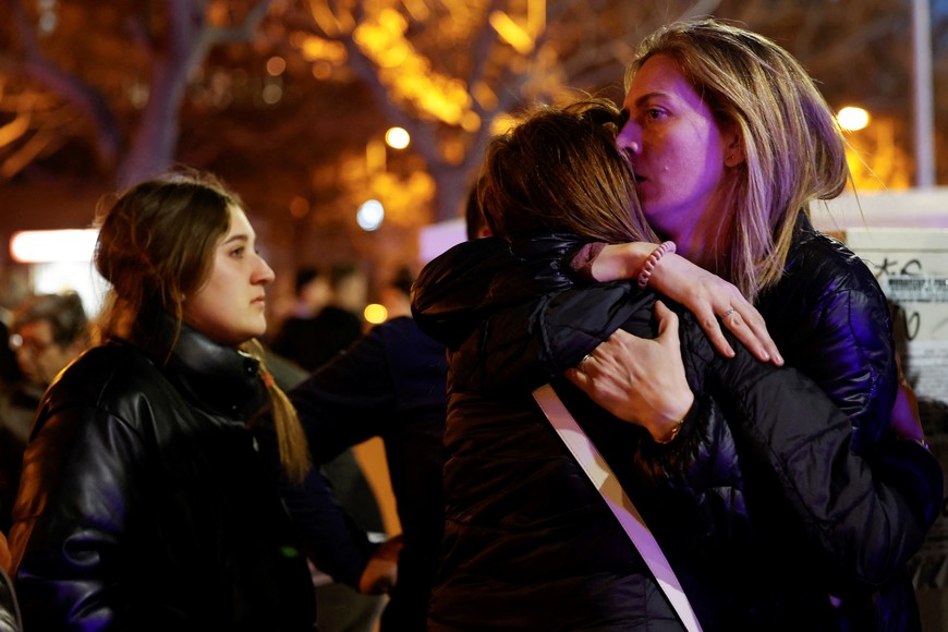 People react at the scene of a fire of apartment building in Valencia, Spain February 22, 2024. REUTERS/Eva Manez