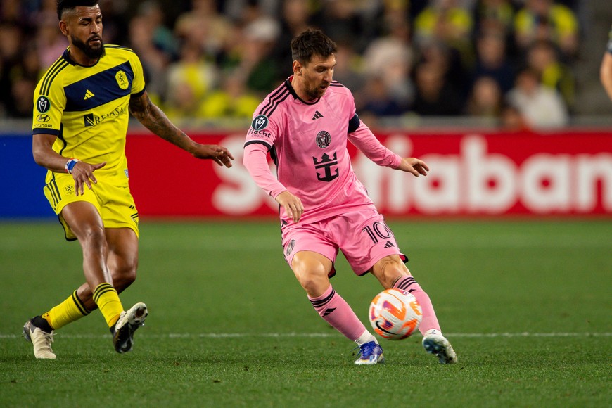 Mar 7, 2024; Nashville, TN, USA; Inter Miami forward Lionel Messi (10) dribbles against Nashville SC during the first half at GEODIS Park. Mandatory Credit: Steve Roberts-USA TODAY Sports