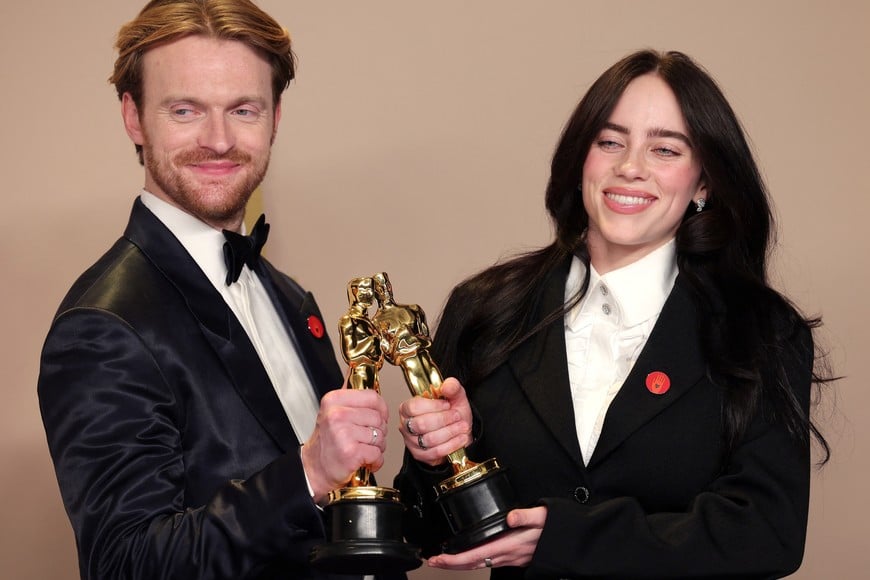 Billie Eilish and Finneas O'Connell pose with the Oscar for Best Original Song for "What Was I Made For?" from "Barbie" in the Oscars photo room at the 96th Academy Awards in Hollywood, Los Angeles, California, U.S., March 10, 2024. REUTERS/Carlos Barria