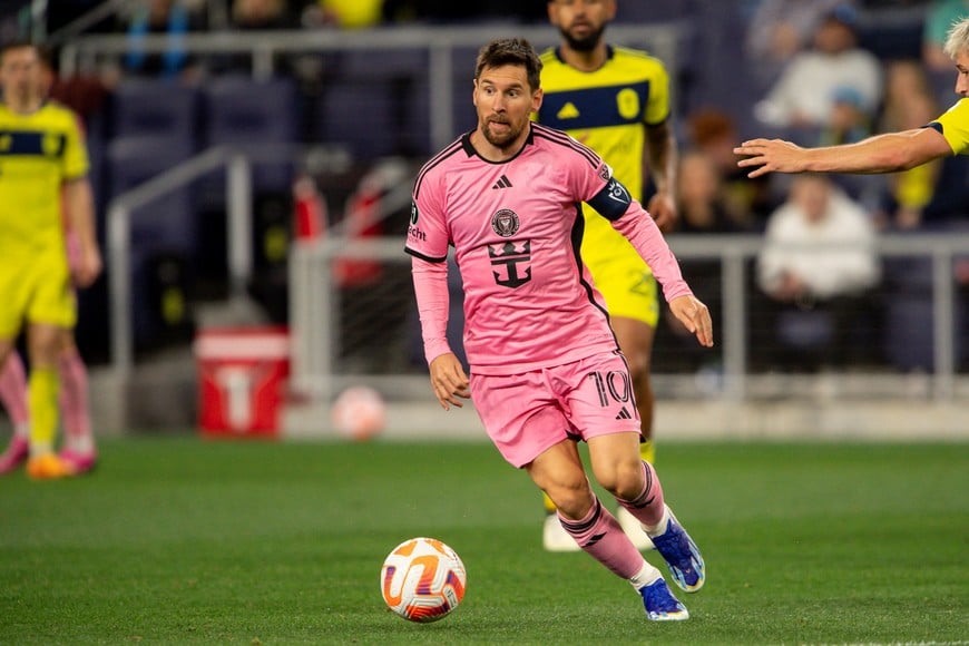 Mar 7, 2024; Nashville, TN, USA;  Inter Miami forward Lionel Messi (10) dribbles against the Nashville SC during the second half at GEODIS Park. Mandatory Credit: Steve Roberts-USA TODAY Sports