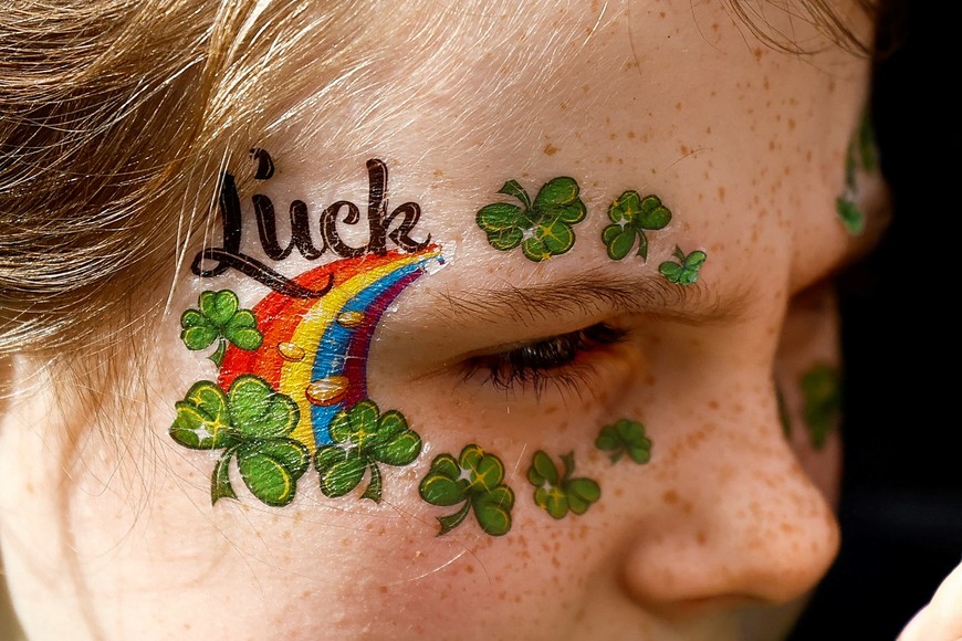 A girl with face painted attends the St. Patrick's Day parade in Dublin, Ireland March 17, 2024. REUTERS/Clodagh Kilcoyne