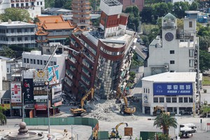 A general view as workers carry out operations at the site where a building collapsed, following the earthquake, in Hualien, Taiwan April 4, 2024. REUTERS/Carlos Garcia Rawlins
