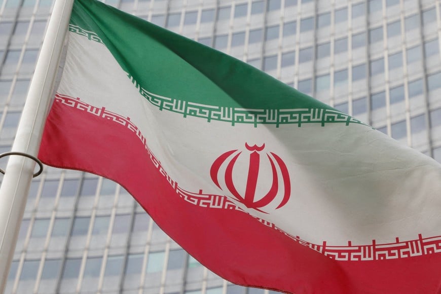 FILE PHOTO: The Iranian flag flutters outside the International Atomic Energy Agency (IAEA) headquarters in Vienna, Austria, March 6, 2023. REUTERS/Leonhard Foeger/File Photo