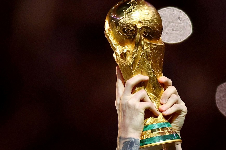 FILE PHOTO: Soccer Football - FIFA World Cup Qatar 2022 - Final - Argentina v France - Lusail Stadium, Lusail, Qatar - December 18, 2022 
General view of Argentina's Lionel Messi lifting the trophy as he celebrates winning the World Cup REUTERS/Hannah Mckay/File Photo