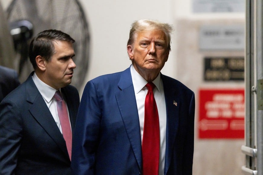 Former U.S. President Donald Trump returning to the courtroom after a break for his criminal trial at New York State Supreme Court in New York, New York, U.S., April 30, 2024. Trump is facing 34 felony counts of falsifying business records related to payments made to adult film star Stormy Daniels during his 2016 presidential campaign. Justin Lane/Pool via REUTERS