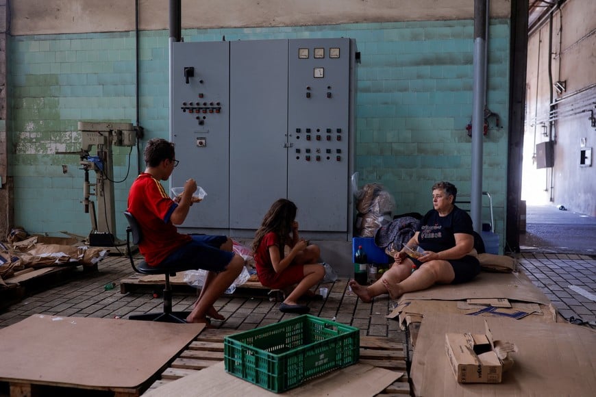 Evacuee Coradina Martins Lemos da Rosa, 62 and her family stay in a warehouse after their homes were flooded at Eldorado do Sul, in Rio Grande do Sul Brazil May 7, 2024. REUTERS/Amanda Perobelli