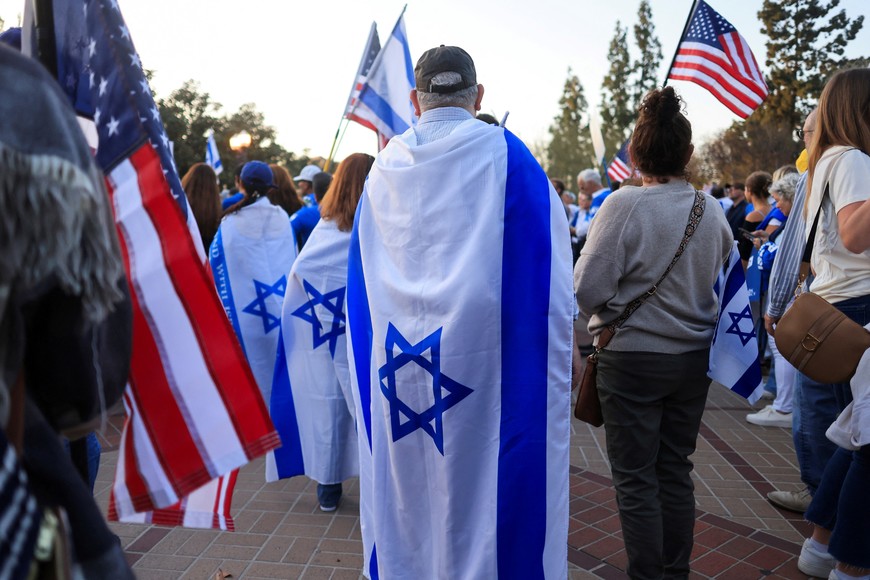 People wear Israeli flags as they participate in a 'United for Israel March' at the University of Southern California (USC), during the ongoing conflict between Israel and the Palestinian Islamist group Hamas, in Los Angeles, California, U.S., May 8, 2024. REUTERS/David Swanson