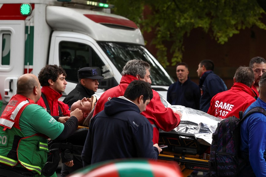 An injured person is moved on a stretcher at the site of a train collision in Buenos Aires, Argentina, May 10, 2024. REUTERS/Agustin Marcarian