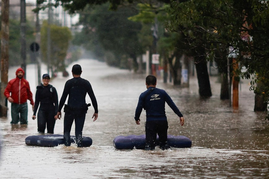 Rescue members work in a flooded street in Porto Alegre, Rio Grande do Sul, Brazil May 10, 2024. REUTERS/Adriano Machado