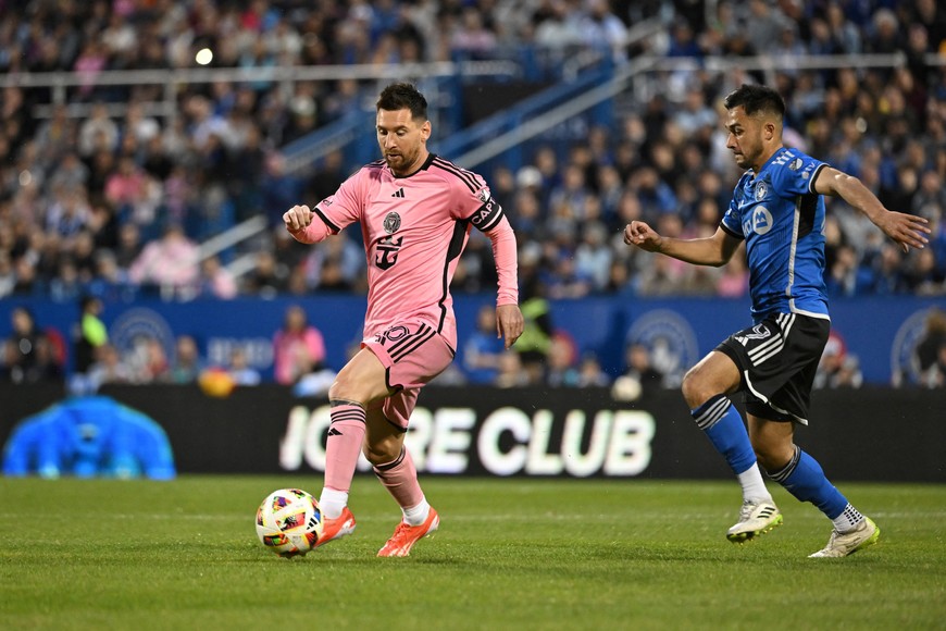 May 11, 2024; Montreal, Quebec, CAN; Inter Miami CF forward Lionel Messi (10) controls the ball against CF Montreal midfielder Mathieu Choiniere (29) in the first half at Stade Saputo. Mandatory Credit: David Kirouac-USA TODAY Sports