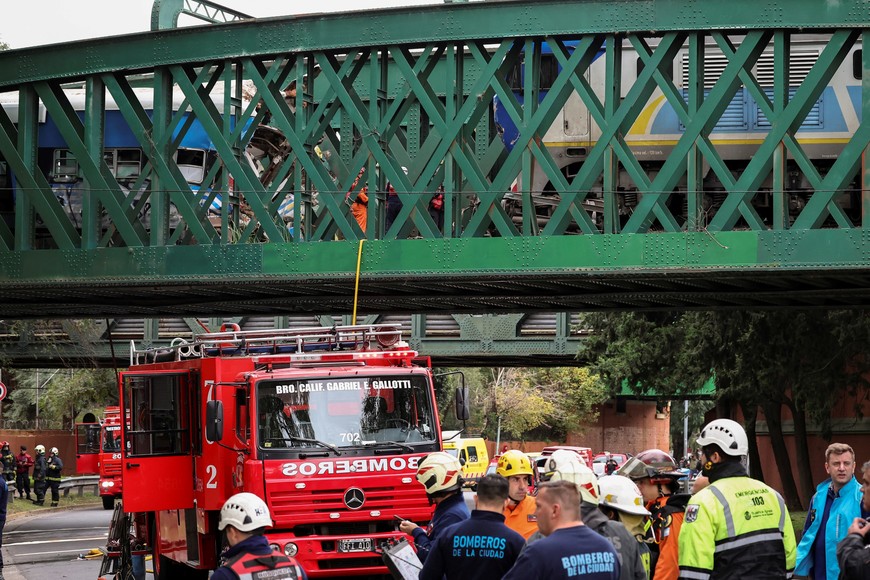 Fire fighters work on the site of a train collision in Buenos Aires, Argentina, May 10, 2024. REUTERS/Agustin Marcarian