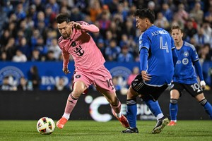 May 11, 2024; Montreal, Quebec, CAN; Inter Miami CF forward Lionel Messi (10) controls the ball against CF Montreal defender Fernando Alvarez (4) in the first half at Stade Saputo. Mandatory Credit: David Kirouac-USA TODAY Sports