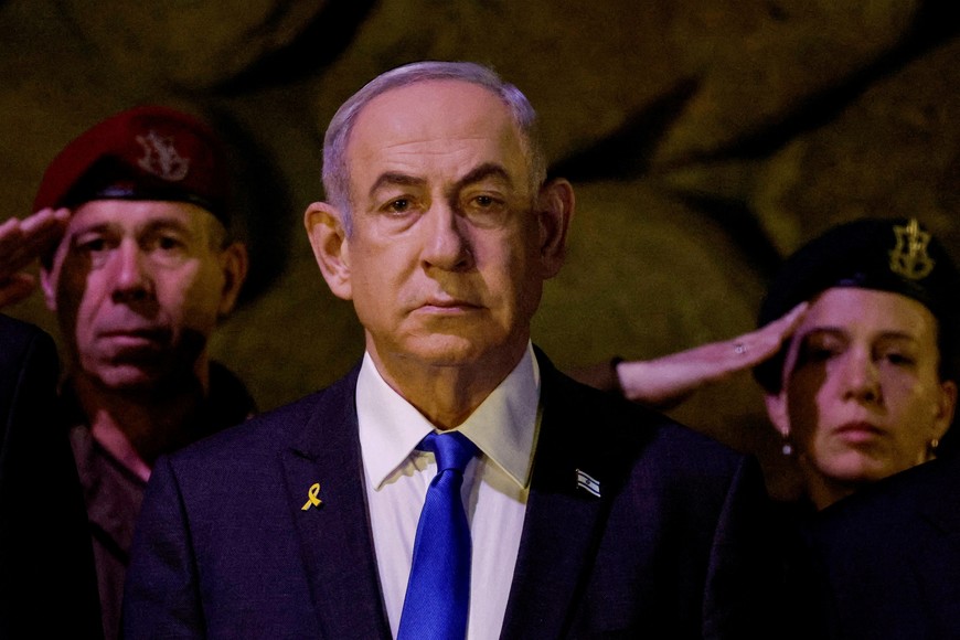 FILE PHOTO: Israeli Prime Minister Benjamin Netanyahu attends a wreath-laying ceremony marking Holocaust Remembrance Day in the Hall of Remembrance at Yad Vashem, the World Holocaust Remembrance Centre, in Jerusalem, May 6, 2024. REUTERS/Amir Cohen/Pool/File Photo