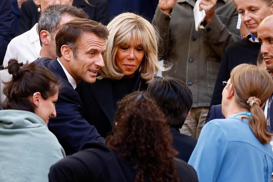 French President Emmanuel Macron and his wife Brigitte Macron attend a mass, held by Pope Francis at the Velodrome Stadium as a part of his journey on the occasion of the Mediterranean Meetings (MED 2023) in Marseille, France, September 23, 2023. REUTERS/Yara Nardi