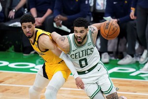 May 21, 2024; Boston, Massachusetts, USA; Boston Celtics forward Jayson Tatum (0) drives the ball against Indiana Pacers guard Tyrese Haliburton (0) in over-time during game one of the eastern conference finals for the 2024 NBA playoffs at TD Garden. Mandatory Credit: David Butler II-USA TODAY Sports