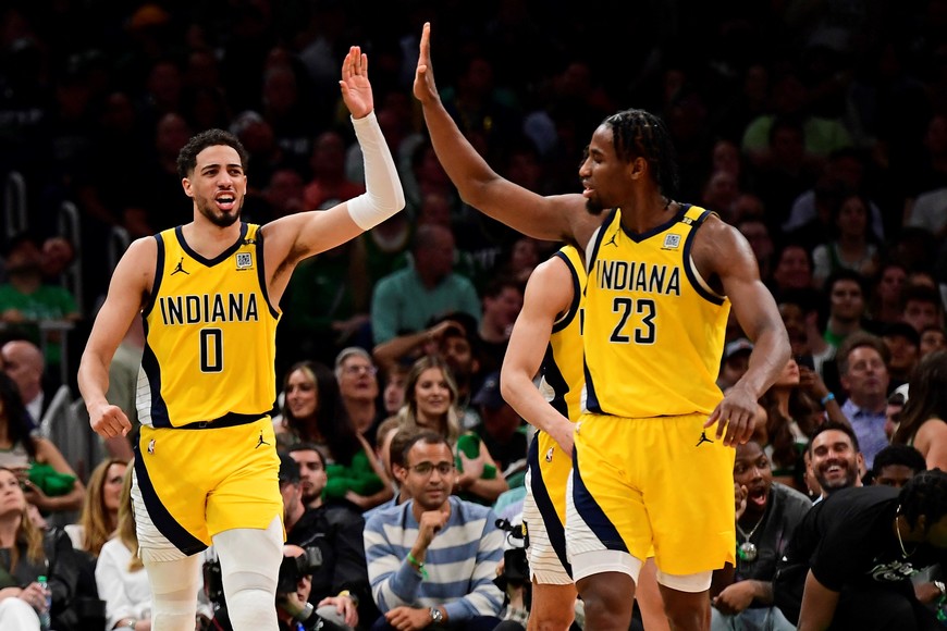 May 21, 2024; Boston, Massachusetts, USA; Indiana Pacers guard Tyrese Haliburton (0) reacts with forward Aaron Nesmith (23) during the second half for game one of the eastern conference finals for the 2024 NBA playoffs at TD Garden. Mandatory Credit: Bob DeChiara-USA TODAY Sports