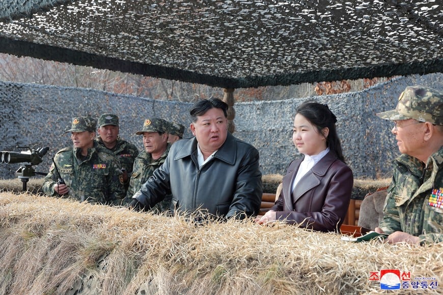 North Korean leader Kim Jong Un and his daughter Kim Ju Ae attend a military demonstration in North Korea, in this picture released on March 16, 2024 by the Korean Central News Agency. KCNA via REUTERS    ATTENTION EDITORS - THIS IMAGE WAS PROVIDED BY A THIRD PARTY. REUTERS IS UNABLE TO INDEPENDENTLY VERIFY THIS IMAGE. NO THIRD PARTY SALES. SOUTH KOREA OUT. NO COMMERCIAL OR EDITORIAL SALES IN SOUTH KOREA.