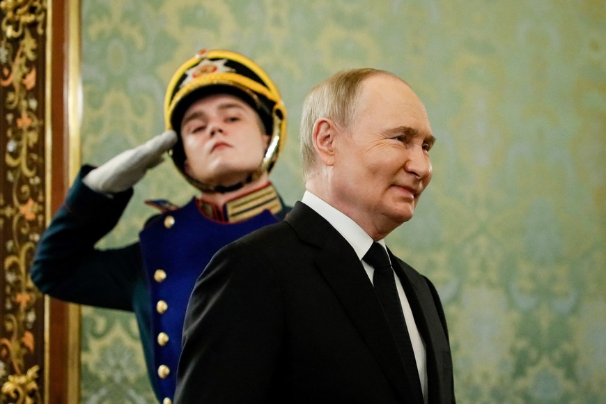 Russian President Vladimir Putin walks to meet Bahrain's King Hamad bin Isa Al Khalifa (not pictured) at the Kremlin in Moscow, Russia, May 23, 2024. YURI KOCHETKOV/Pool via REUTERS