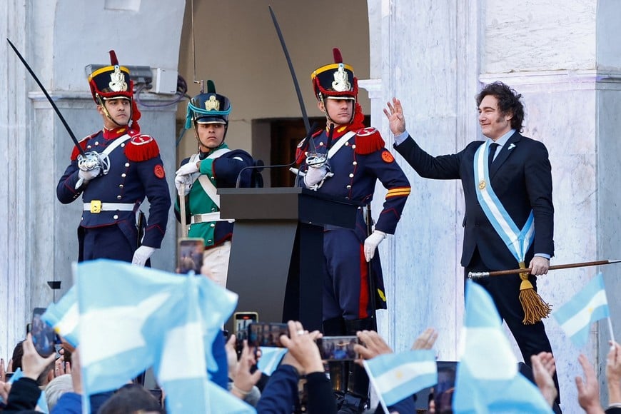 Argentina's President Javier Milei waves to supporters outside the Cabildo during the commemoration of the 214th anniversary of the May Revolution, in Cordoba, Argentina May 25, 2024. REUTERS/Leandro Bustamante Gomez