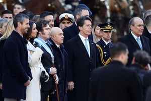 Argentina's Chief of the Cabinet Nicolas Posse stands next to Argentina’s President Javier Milei outside the Buenos Aires' Cathedral for the traditional Te Deum to commemorate the 214th anniversary of the May Revolution, in Buenos Aires, Argentina, May 25, 2024. REUTERS/Agustin Marcarian