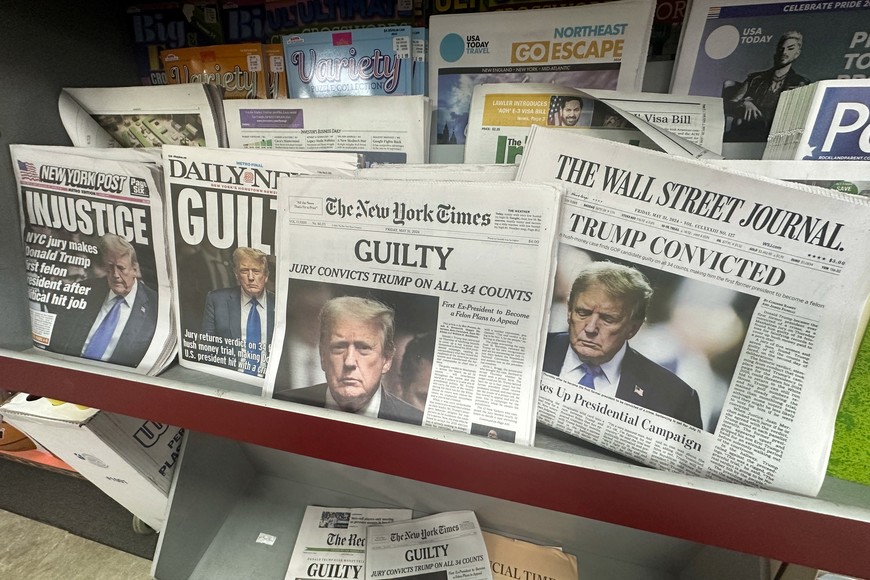 A news stand shows off headlines following the announcement of the verdict on former U.S. President Donald Trump's criminal trial, over charges that he falsified business records to conceal money paid to silence adult film star Stormy Daniels in 2016, in Nyack, New York, U.S. May 31, 2024. REUTERS/Mike Segar