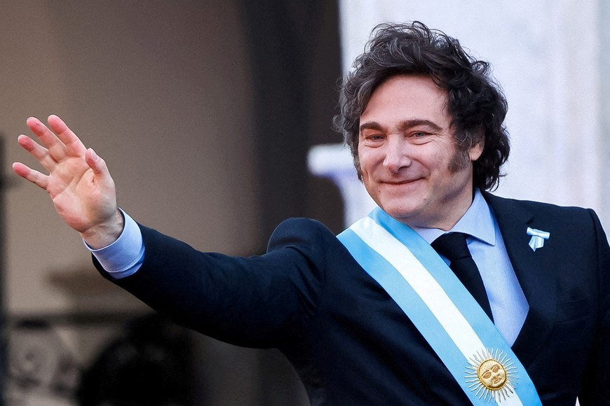 FILE PHOTO: Argentina's President Javier Milei waves to supporters outside the Cabildo during the commemoration of the 214th anniversary of the May Revolution, in Cordoba, Argentina May 25, 2024. REUTERS/Leandro Bustamante Gomez/File Photo