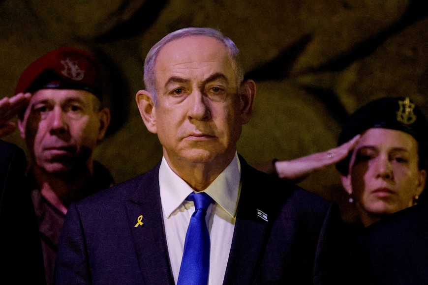 FILE PHOTO: Israeli Prime Minister Benjamin Netanyahu attends a wreath-laying ceremony marking Holocaust Remembrance Day in the Hall of Remembrance at Yad Vashem, the World Holocaust Remembrance Centre, in Jerusalem, May 6, 2024. REUTERS/Amir Cohen/Pool/File Photo