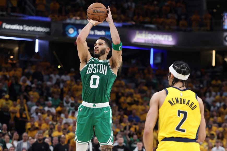 May 25, 2024; Indianapolis, Indiana, USA; Boston Celtics forward Jayson Tatum (0) shoots the ball against Indiana Pacers guard Andrew Nembhard (2) during the fourth quarter of game three of the eastern conference finals in the 2024 NBA playoffs at Gainbridge Fieldhouse. Mandatory Credit: Trevor Ruszkowski-USA TODAY Sports