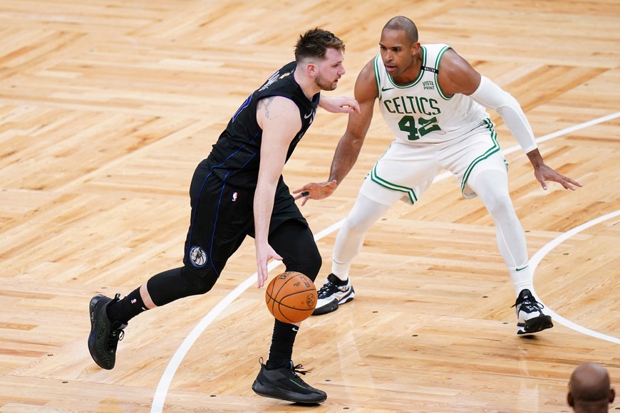 Jun 6, 2024; Boston, Massachusetts, USA; Dallas Mavericks guard Luka Doncic (77) controls the ball against Boston Celtics center Al Horford (42) in the fourth quarter during game one of the 2024 NBA Finals at TD Garden. Mandatory Credit: David Butler II-USA TODAY Sports