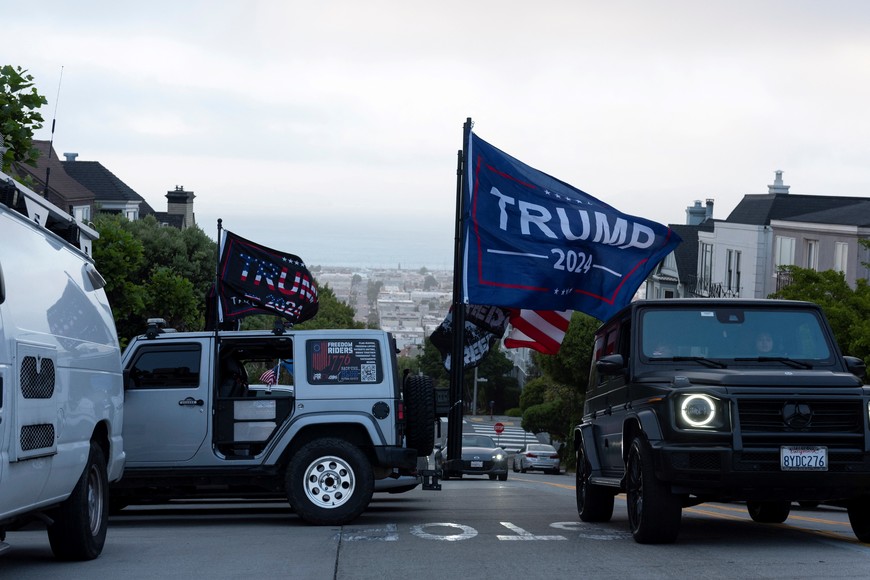 Supporters of Republican presidential candidate and former U.S. President Donald Trump rally in Pacific Heights during a campaign fundraiser in San Francisco, California, U.S., June 6, 2024.   REUTERS/Laure Andrillon