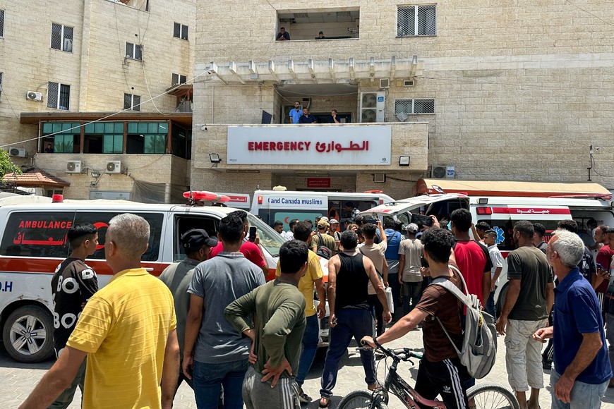 People gather as Palestinians wounded in an Israeli strike are brought to Al-Aqsa Martyrs Hospital, amid the Israel-Hamas conflict, in Deir Al-Balah, in the central Gaza Strip, June 8, 2024. REUTERS/Doaa Rouqa