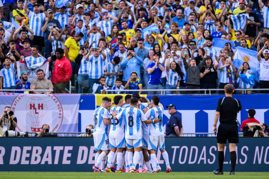 Jun 9, 2024; Chicago, Illinois, USA; Argentina forward Angel Di Maria (11) celebrates his goal with teammates against Ecuador during the first half at Soldier Field. Mandatory Credit: Daniel Bartel-USA TODAY Sports
