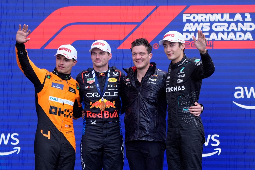 Formula One F1 - Canadian Grand Prix - Circuit Gilles Villeneuve, Montreal, Canada - June 9, 2024
Red Bull's Max Verstappen celebrates on the podium after winning the Canadian Grand Prix alongside second place McLaren's Lando Norris and third place Mercedes' George Russell REUTERS/Mathieu Belanger