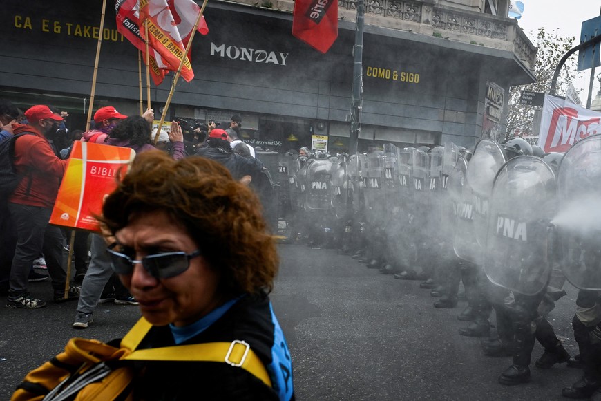 Law enforcement officers stand guard as demonstrators attend a protest near the National Congress, on the day Senators debate Argentina's President Javier Milei's economic reform bill, known as the "omnibus bill", in Buenos Aires, Argentina, June 12, 2024. REUTERS/Mariana Nedelcu