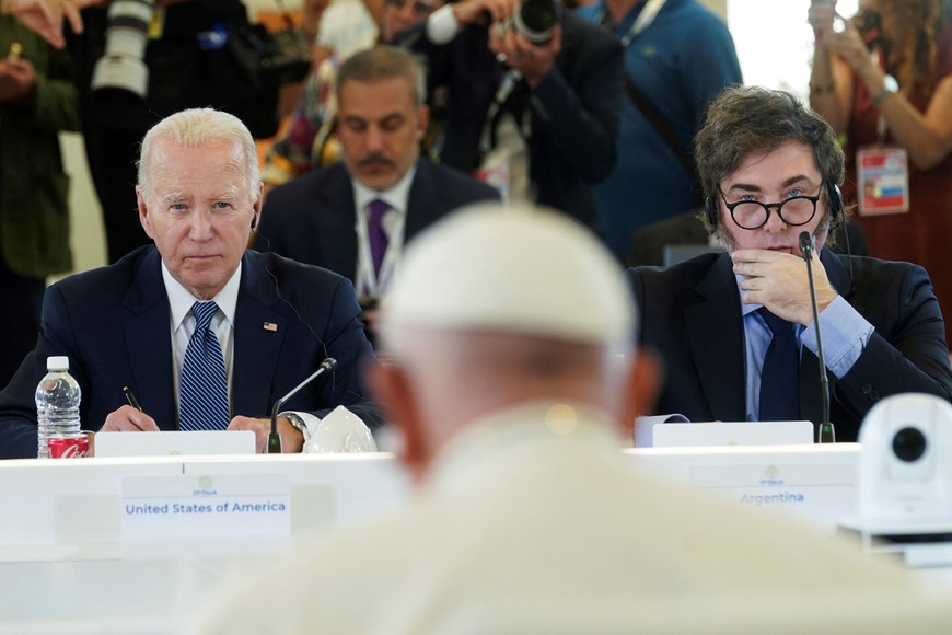 U.S. President Joe Biden and Argentina's President Javier Milei listen to Pope Francis on the second day of the G7 summit in Borgo Egnazia, Italy June 14, 2024. REUTERS/Kevin Lamarque