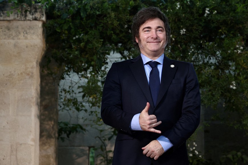 Argentina’s President Javier Milei gestures, as G7 leaders and representatives of States and International Organisations gather for a family photo on the second day of the G7 summit at the Borgo Egnazia resort, in Savelletri, Italy June 14, 2024. REUTERS/Guglielmo Mangiapane