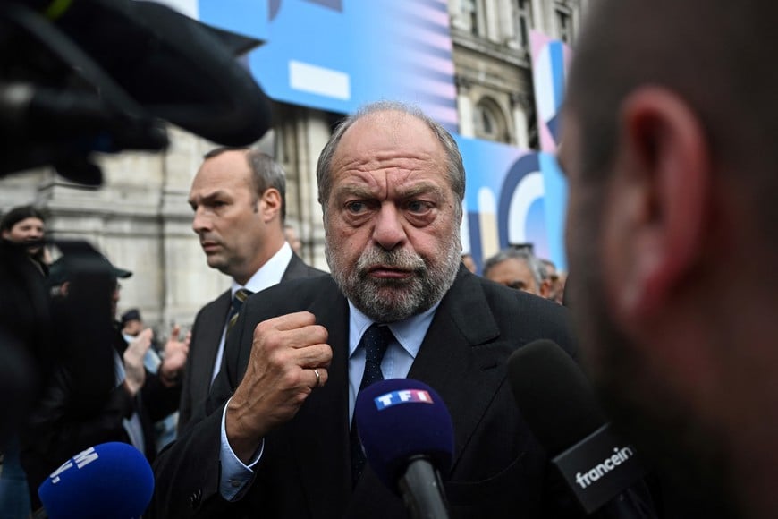 French Justice Minister Eric Dupond-Moretti talks to journalists during a demonstration against anti-Semitism in front of Paris City Hall after three teenagers aged 12 to 13 indicted in Courbevoie, accused of rape and anti-Semitic violence against a 12-year-old girl, in Paris, France, June 19, 2024. REUTERS/Dylan Martinez