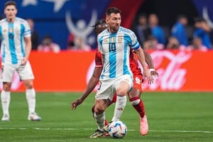 Jun 20, 2024; Atlanta, GA, USA; Argentina forward Lionel Messi (10) plays the ball in front of Canada midfielder Ismael Kone (8) during the first half at Mercedez-Benz Stadium. Mandatory Credit: Dale Zanine-USA TODAY Sports